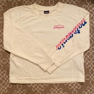 Size L Patagonia girls sweatshirt in cream with retro lettering on sleeve